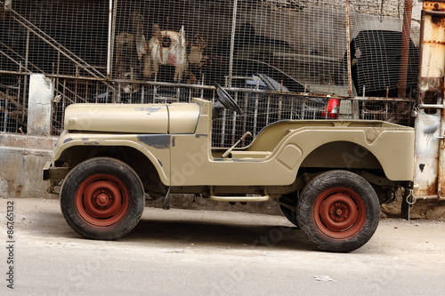 chasis of a jeep being modified  and painted