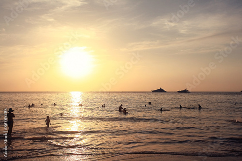 Fototapeta Naklejka Na Ścianę i Meble -  sunset on the beach silhouettes of people