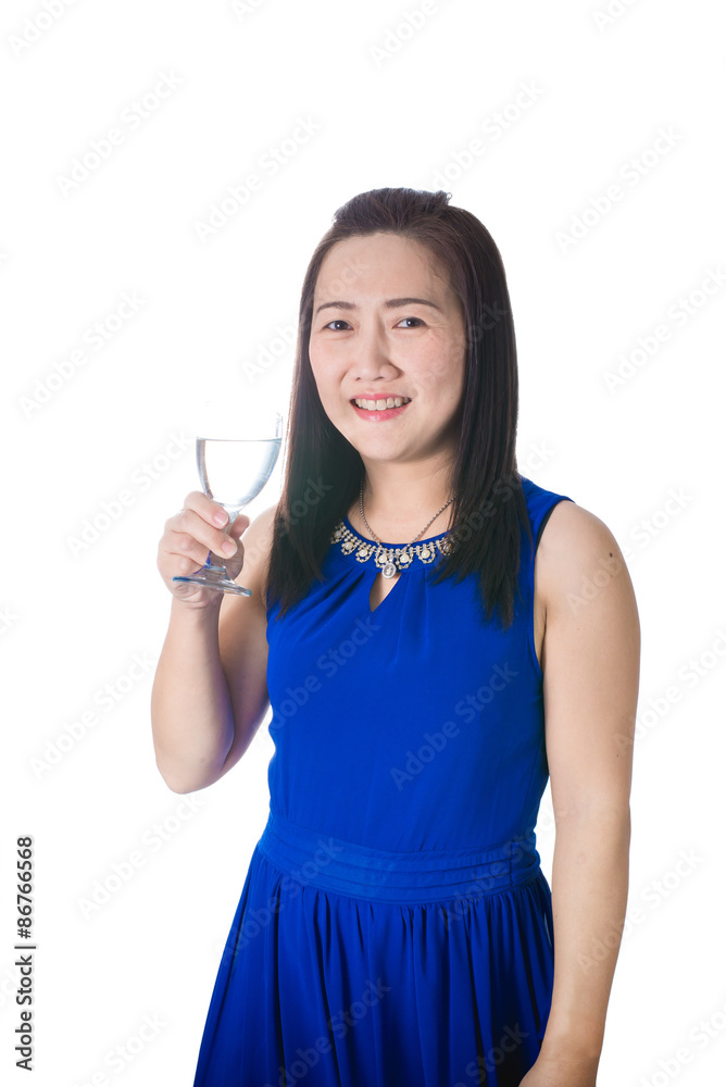 Happy Asian woman with glass of water isolated on the white back Happy Asian woman with glass of water isolated on the white back