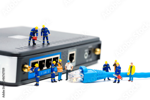 Fotografie Technicians connecting network cable. Network connection concept