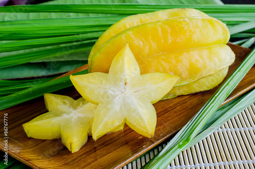 Starfruit, Carambola on wooden plate photo