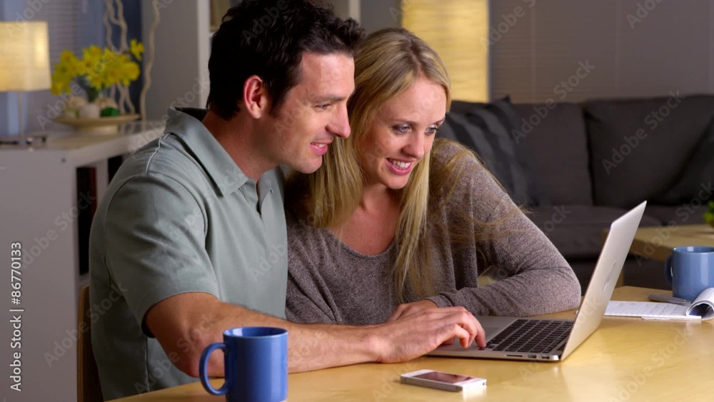 Couple looking at hotels to stay at Couple looking at hotels to stay at