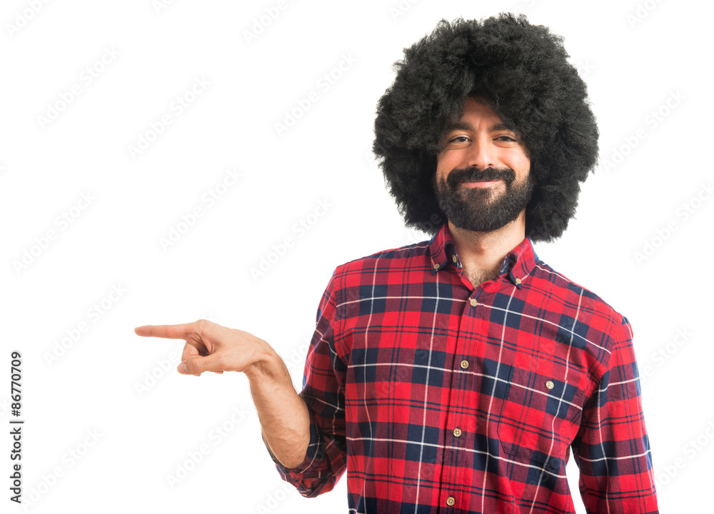 Afro man pointing to the lateral Afro man pointing to the lateral