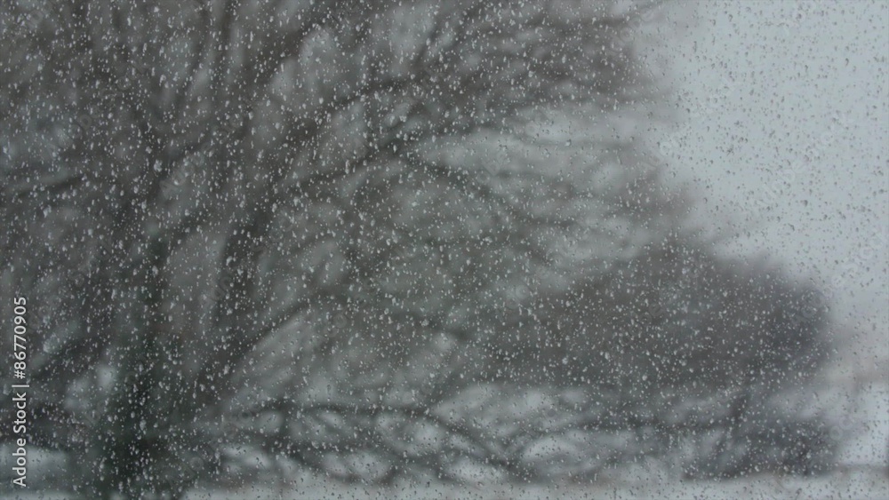 Crazy winter blizzard storm through house window rack focus