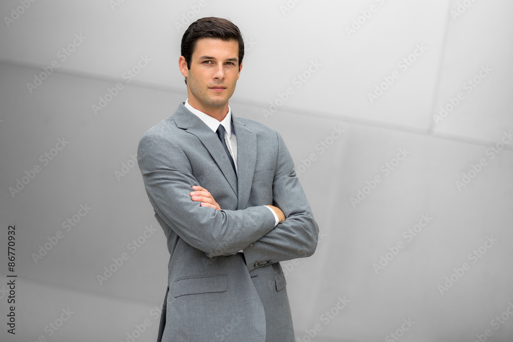 Premium Photo  Vertical portrait of stylish handsome business man wearing  fashion suit standing near window in modern office room looking at camera  front view of bearded businessman posing at workplace