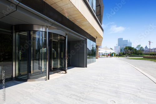 modern building exterior with brick road floor