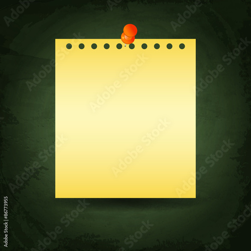 Yellow paper and push pin on green chalkboard background