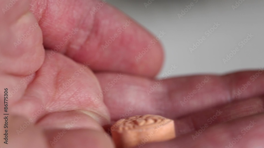 man getting childrens vitamin man getting childrens vitamin
