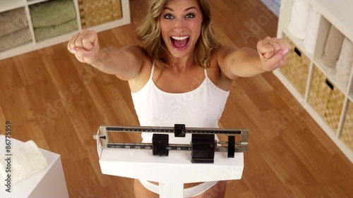 Happy woman celebrating weight loss