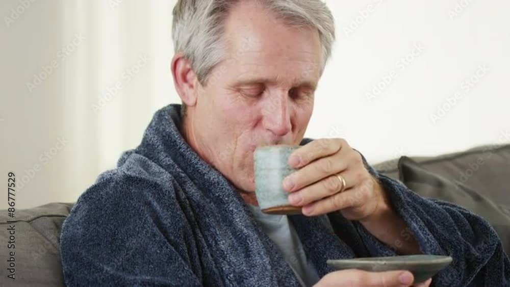 Senior man smiling looking at camera with tea Senior man smiling looking at camera with tea