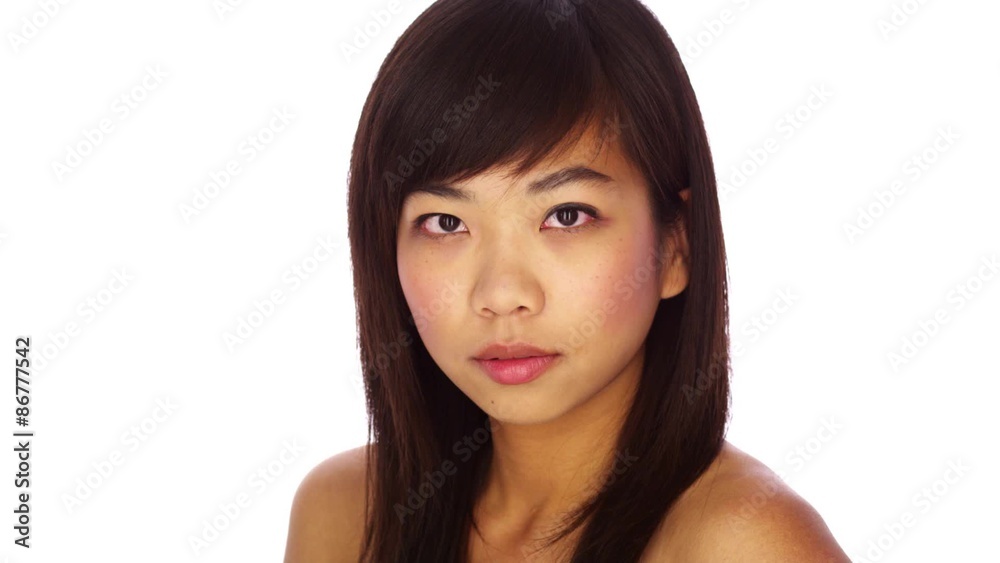 Cute Chinese woman looking at camera Cute Chinese woman looking at camera
