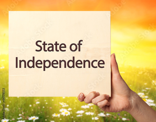 Female hand holding a card with the text: State of Independence