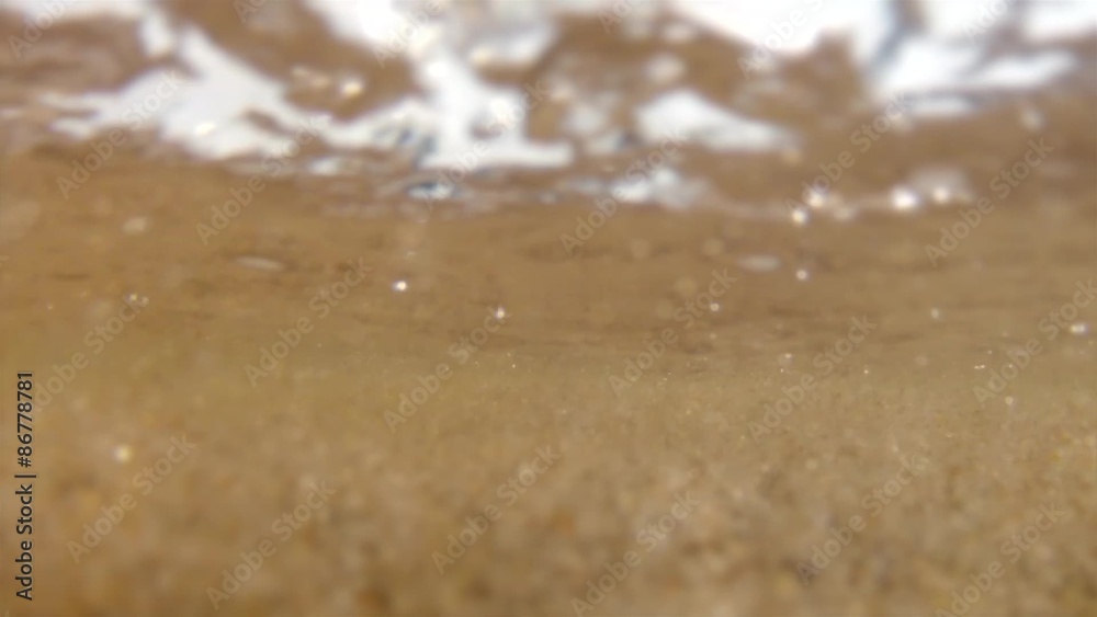 underwater shot of toddler playing at the beach in water underwater shot of toddler playing at the beach in water