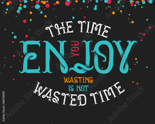 Motivating quote "The time you enjoy wasting is not wasted time" on dark background