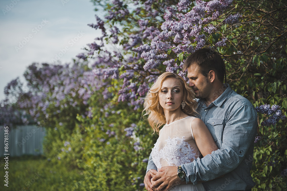 Newly-married couple among lilac bushes 3153. Newly-married couple among lilac bushes 3153.