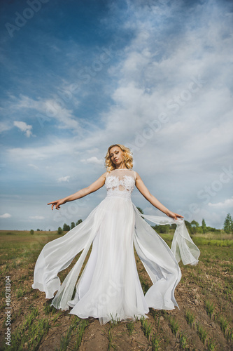 The girl in a white dress in the field 3151.