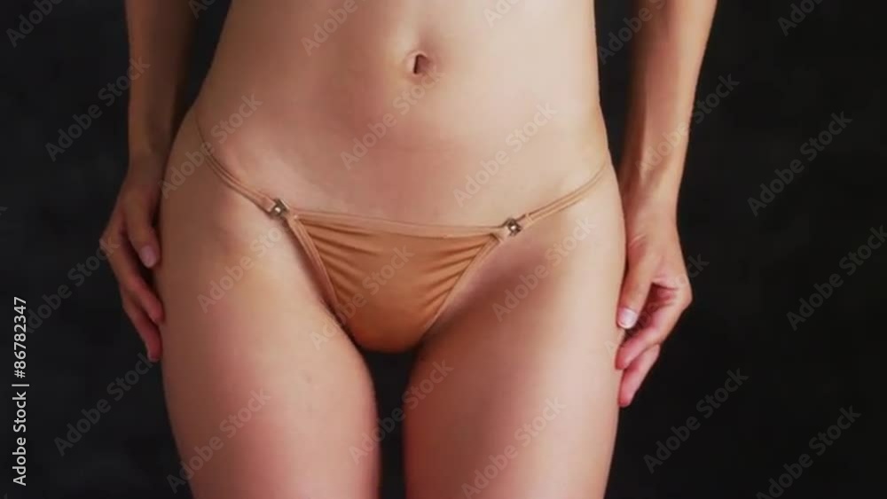 Woman wearing tan bikini Woman wearing tan bikini