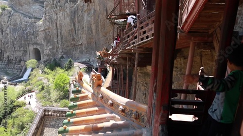 tourists visiting the hanging temple monastery at datong china