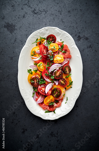 Colorful tomato salad with fresh parsley