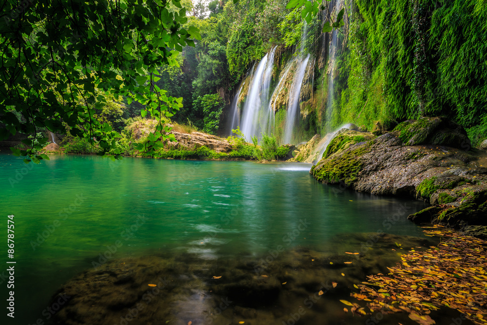 a beautiful waterfall in the forest on a river a beautiful waterfall in the forest on a river