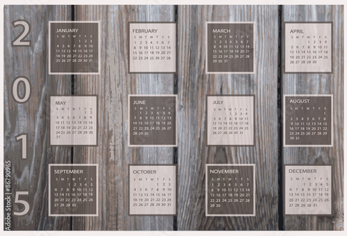 Calendar for 2015 on wood background.