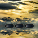 Zen spa concept background-Zen black massage stones reflected in water