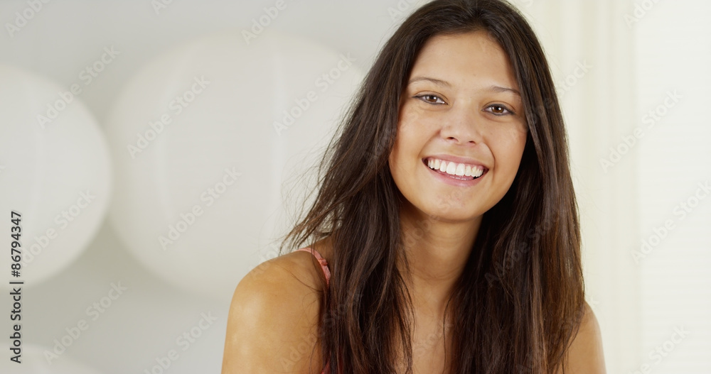 Cute young Hispanic woman smiling and laughing Cute young Hispanic woman smiling and laughing