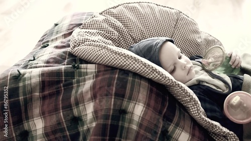 toddler with a flu lying on a floor photo