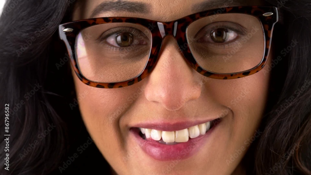 Geeky Mexican woman smiling and looking at camera Geeky Mexican woman smiling and looking at camera