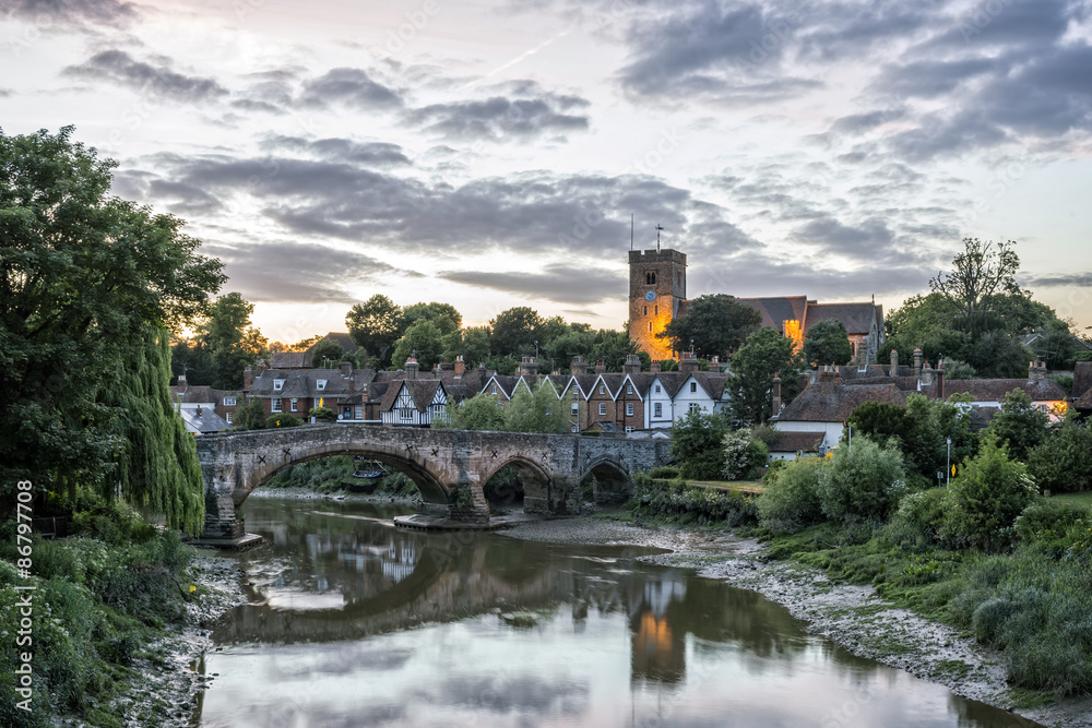 View to Aylesford village in Kent, England with medieval bridge and church