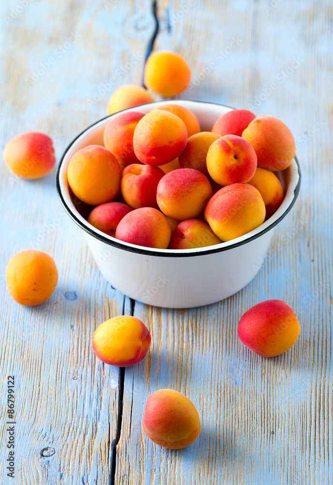 apricots on wooden surface apricots on wooden surface
