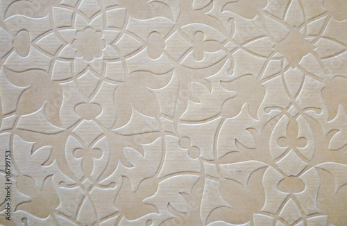 Beige vintage paper page with embossed pattern