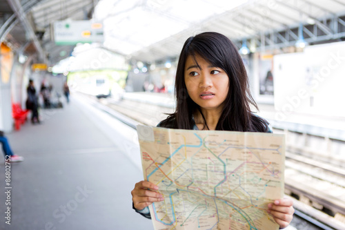 Fotografie Young attractive asian tourist lost in Paris
