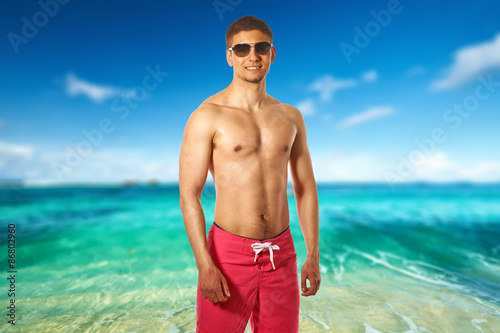 Man on beach at Seychelles