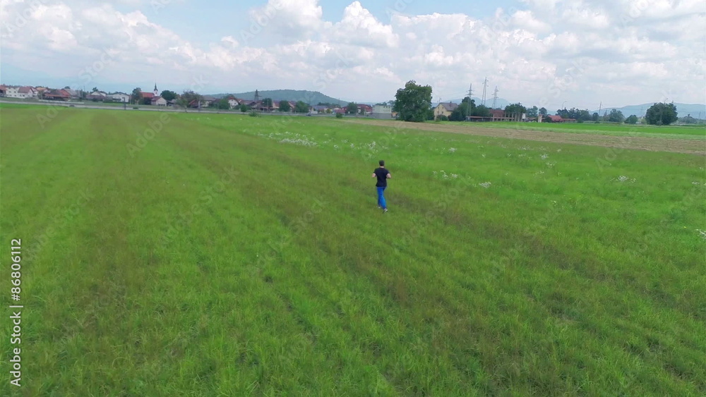 Aerial Running on Green Grass Aerial Running on Green Grass