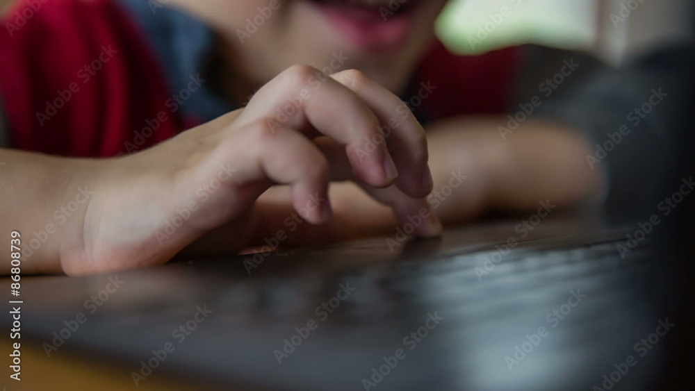 Kid finger on touch pad close up Kid finger on touch pad close up