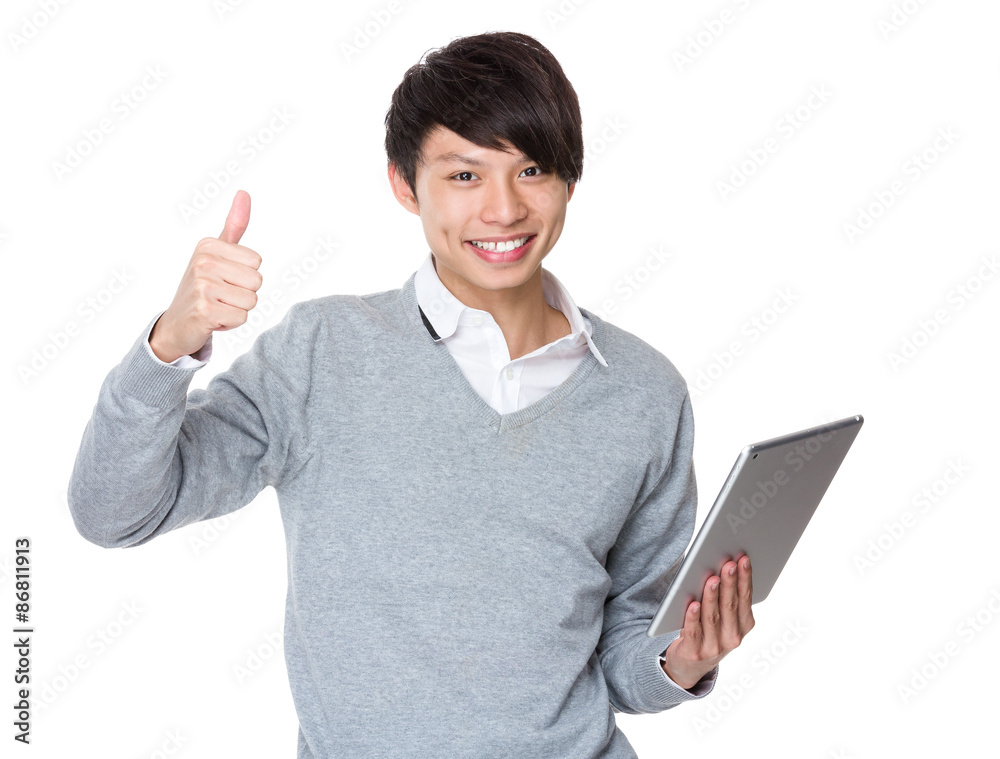 Businessman use of the tablet pc and thumb up Businessman use of the tablet pc and thumb up