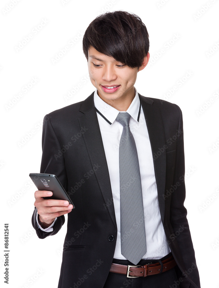 Asian Businessman look at the cellphone Asian Businessman look at the cellphone