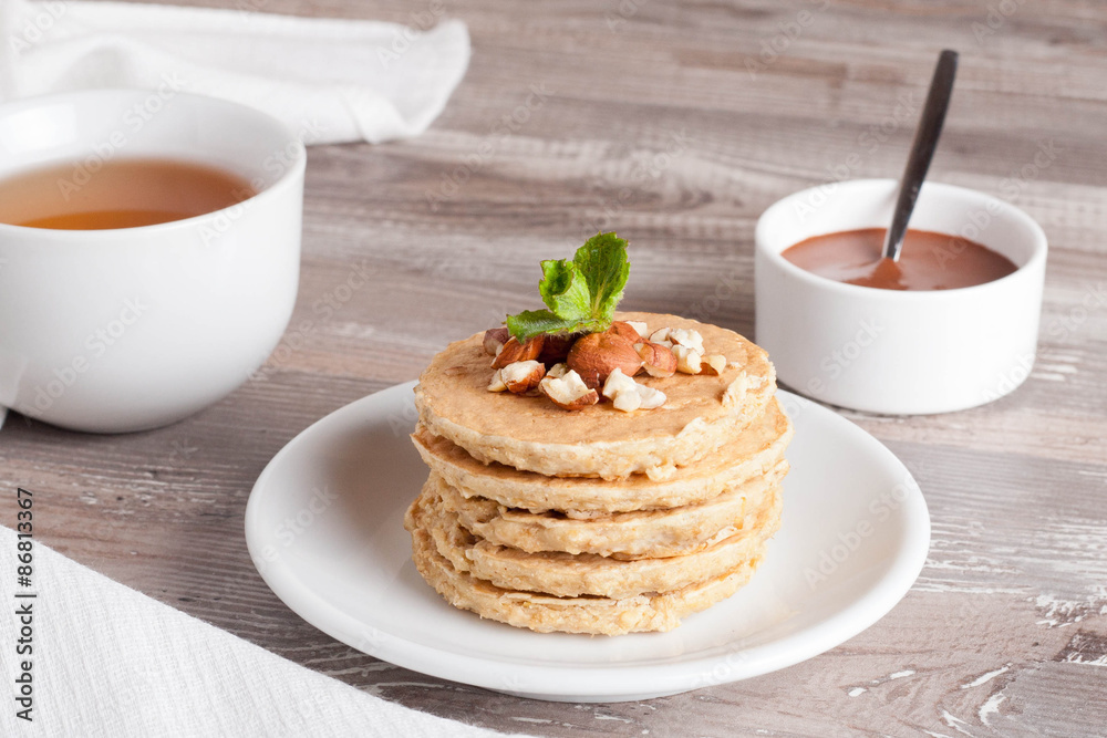 pancakes with nuts, decorated mint for breakfast, horizontal pancakes with nuts, decorated mint for breakfast, horizontal