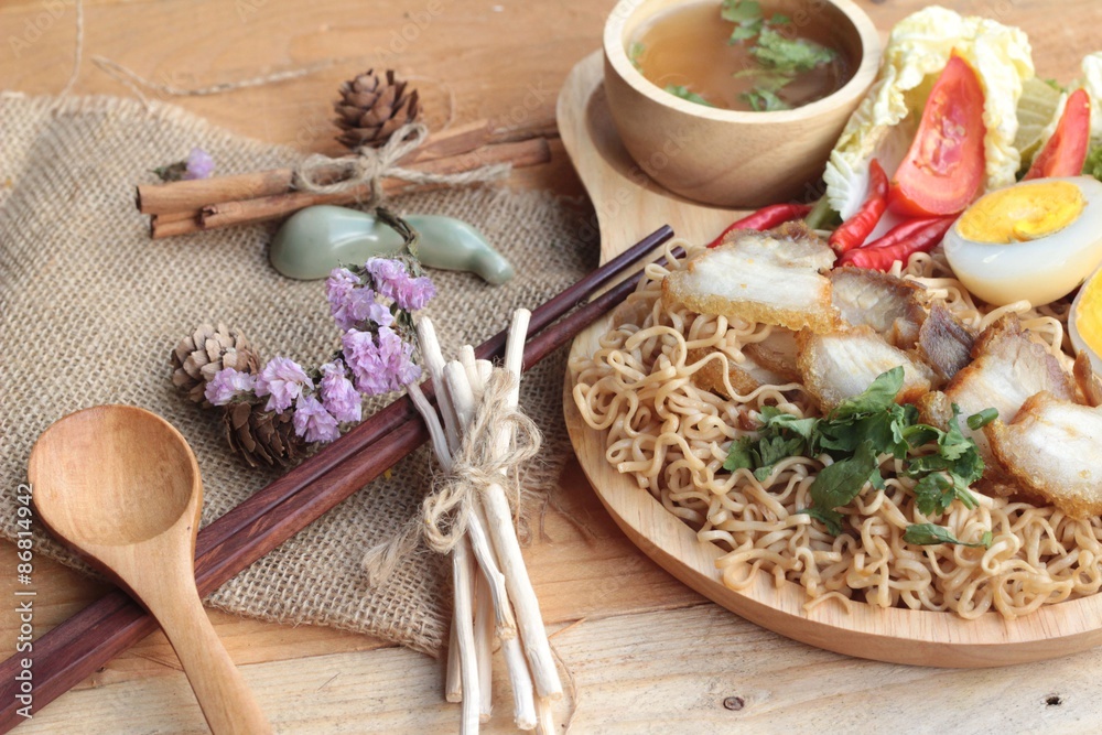 Instant noodles soup put crispy pork and egg Instant noodles soup put crispy pork and egg