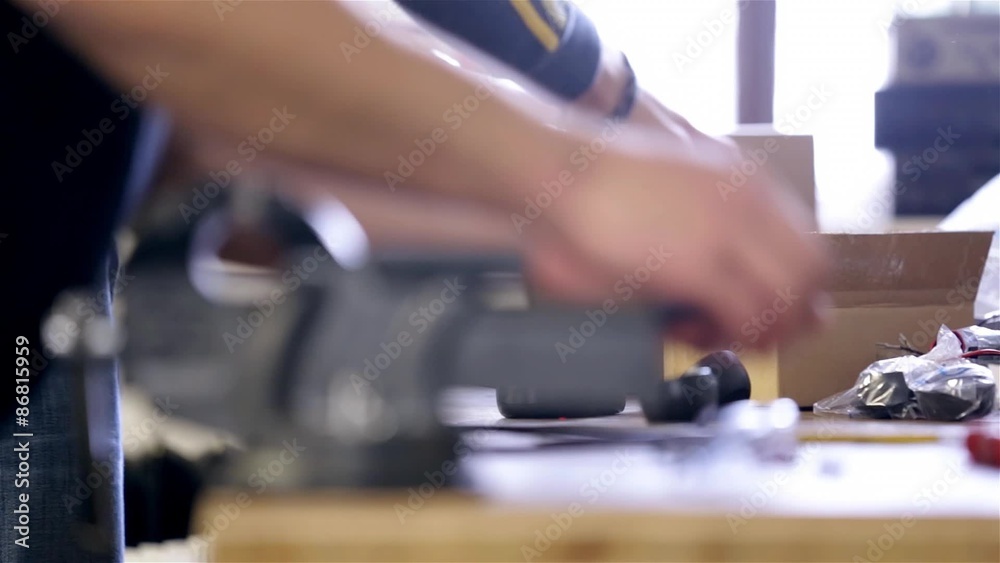 Two man preparing equipment in workshop Two man preparing equipment in workshop