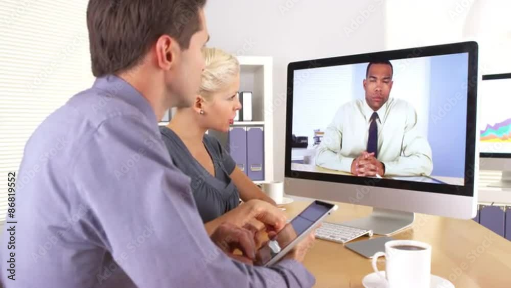 Employees updating their manager in a video conference
