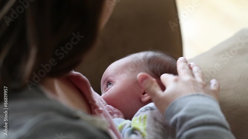 a mother nursing her baby boy photo