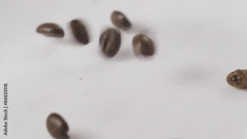 dark roasted coffee beans for espresso falling in slow motion dark roasted coffee beans for espresso falling in slow motion