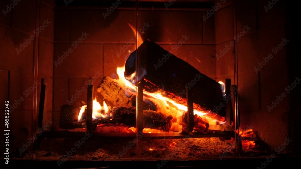 A closeup shot of hot fire in a home fireplace