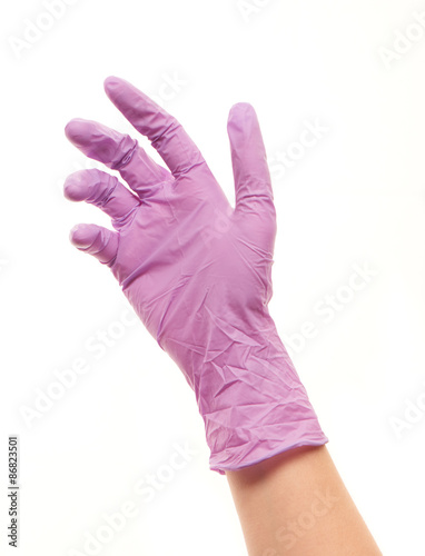 Female doctor's hand in purple sterilized surgical glove