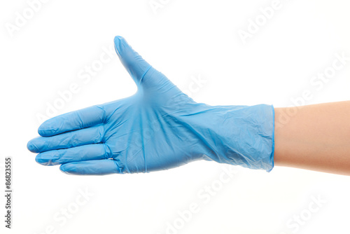 Fototapeta Naklejka Na Ścianę i Meble -  Female doctor's hand in blue surgical glove giving for handshake