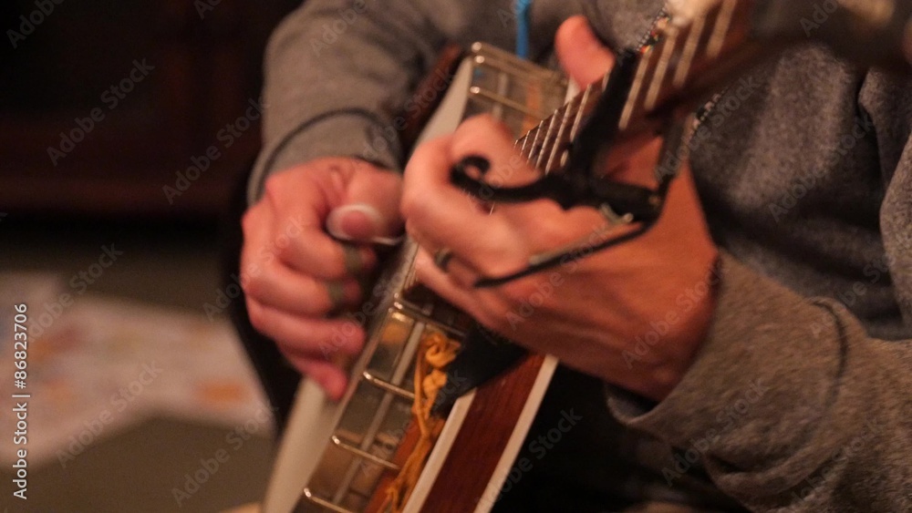 A man playing the banjo in a band