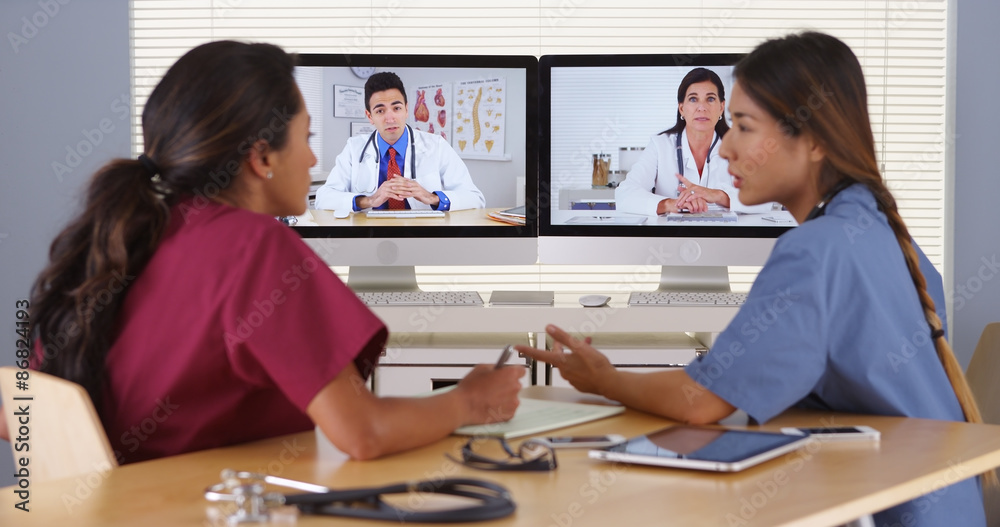 Group of diverse medical doctors video conferencing Group of diverse medical doctors video conferencing