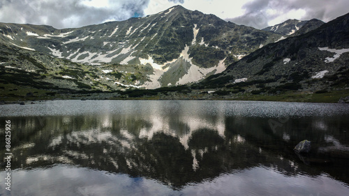 Musala peak reflected in one of the lakes of Rila mt national park Bulgaria